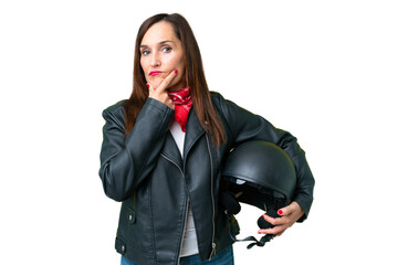 Middle age caucasian woman with a motorcycle helmet over isolated chroma key background thinking