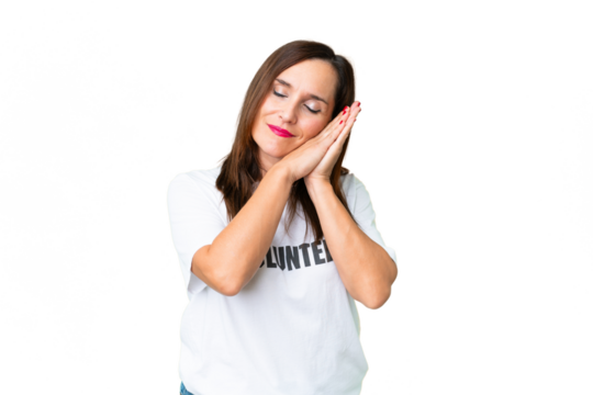 Middle age volunteer woman over isolated chroma key background making sleep gesture in dorable expression