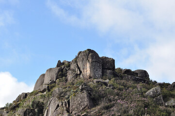 Fototapeta na wymiar Rocks and sky, Mountain top, big stones on top of elevation