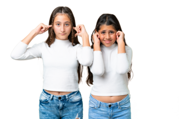 Friends girls holding gift and a birthday cake over isolated chroma key background covering both ears with hands