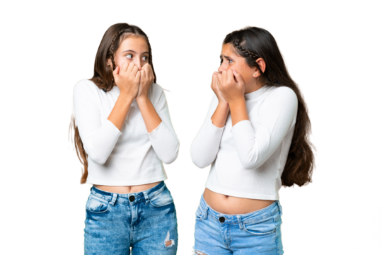 Friends girls holding gift and a birthday cake over isolated chroma key background is a little bit nervous and scared putting hands to mouth