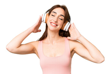 Naklejka premium Young caucasian woman over isolated chroma key background listening music
