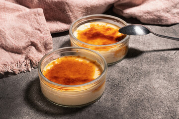 Creme brulee (also known as burnt cream or Trinity cream). Dessert consisting of a custard base topped with a layer of hardened caramelized sugar.