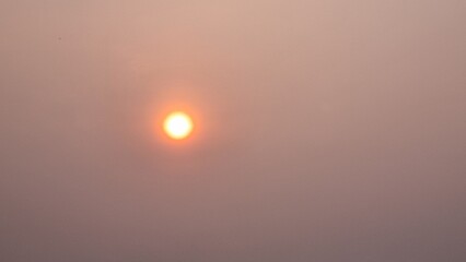 abstract background photo of rising sun thailand gradient yellow white orange blur sun with orange red beam rising into the sky light color orange red half yellow golden rising shade sunrise sunlight 