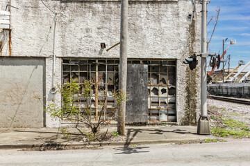Side of abandoned building in industrial area of urban Birmingham Alabama - 594990318