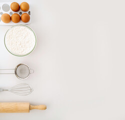 Frame of food ingredients for baking on a gently pink pastel background. Cooking flat lay with copy space. Top view. Baking concept. Mockup.