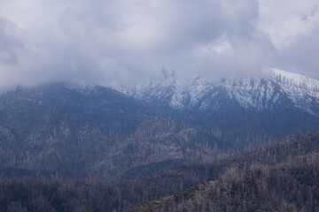 Snow capped mountain with clouds