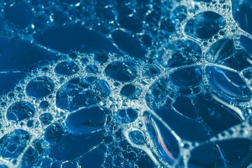 bubbles sitting in the middle of water and another with blue sky