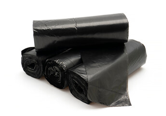 Stack of Unused Black Plastic Trash Bags (Rolls) with Handles on Plain White Background

