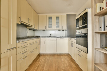 a kitchen with all white cupboards and appliances on the counter tops in this photo is taken from the inside