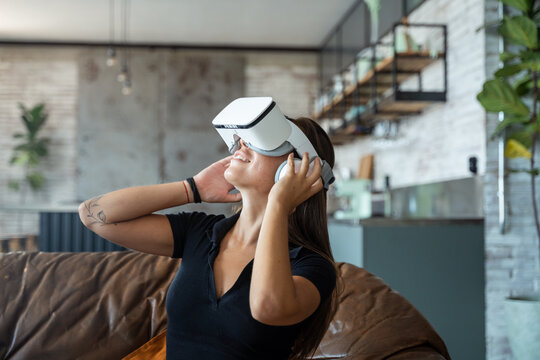 Woman in VR headset interacting with digital world
