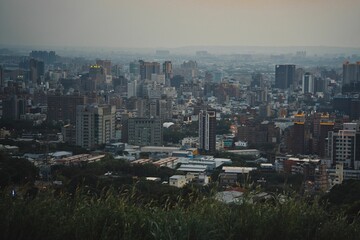 Scenic view of a modern cityscape featuring tall buildings in the evening