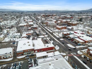 Aerial view of residential buildings and roads covered in the snow in Keene, New Hampshire