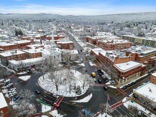 Aerial view of residential buildings and roads covered in the snow in Keene, New Hampshire