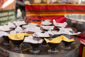 Putu Piring selling during Ramadan bazaar, it is a round-shaped steamed rice flour kueh or sweet snack filled with palm sugar.