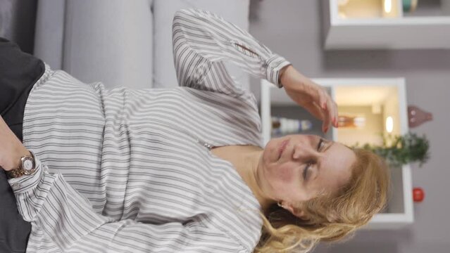 Vertical Video of Mature old woman faints at home and falls to the ground.
Feeling bad, the old woman faints and collapses to the ground.
