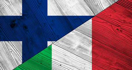 Background with flag of Finland and Italy on split wooden table. 3d illustration