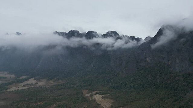 Drone shot of Laos mountain with fog
