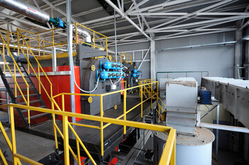 Steam generation vessel working in the production hall of the biggest in Ukraine boiler-house using biofuel wood chips