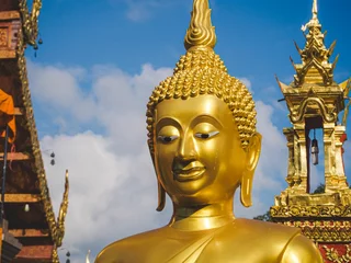 Fotobehang Historisch monument Closeup of a Golden Buddha statue in Wat Phratat Doi Suthep temple, Chiang  Mai, Thailand