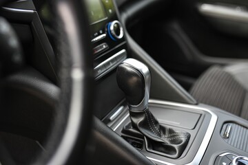 Closeup detail of a car's gear shifter, manual transmission
