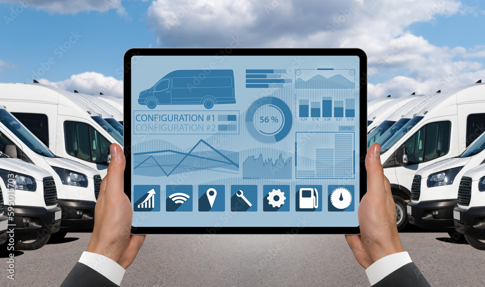 Aufkleber Manager with a digital tablet on the background of vans. Fleet management	