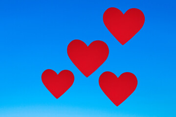 heart shape pattern with red heart under blue sky symbolizing love