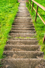 Stairs going down the hill with the concrete paving floor