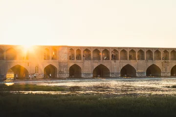 Keuken foto achterwand Khaju Brug Isfahan, Iran - May 2022: people chill and socialize around SioSe Pol or Bridge of 33 arches, one of the oldest bridges of Esfahan and longest bridge on Zayandeh River