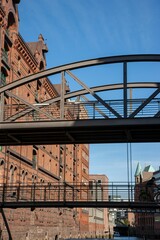 Vertical shot of a bridge in The Speicherstadt on a sunny day in Hamburg, Germany