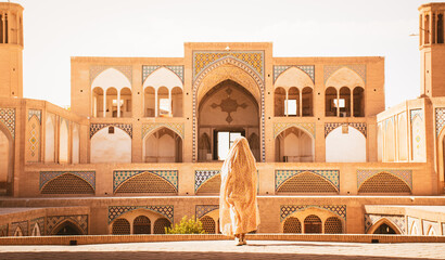 Kashan, Iran - 29th may, 2022: Tourists and pilgrims explore sightseeing beautiful Agha Bozorg Mosque