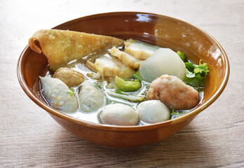 boiled Hakka meatball made fish and shrimp with bean sprout and lettuce in spicy soup on bowl 