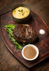 rib eye beef steak with butter sauce and gravy