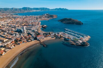 Is an aerial view of the beautiful Spanish coastal town of Aguilas, located in the Murcia region