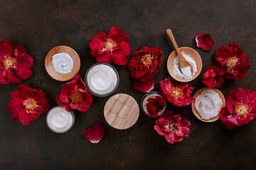skincare products and dog rose flowers. natural cosmetics for home spa treatment