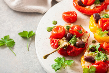 stuffed bell peppers with quinoa tomatoes olives and herb sauce chimichurri