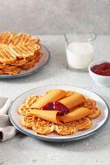 waffles with Norwegian brunost traditional brown cheese and raspberry jam