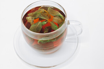 Cup of tea and mint on a white background