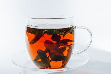 Cup of tea and mint on a white background