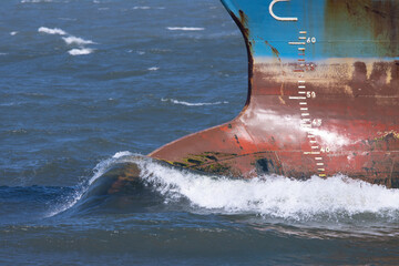 bow of cargo ship moving through water