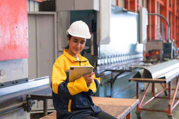 Professional heavy industry engineer worker wearing safety uniform in a metal manufacture warehouse , maintenance service check for safety first concept .