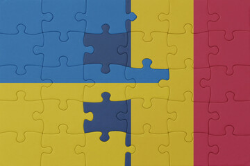 puzzle with the national flag of ukraine and chad . macro.concept.