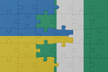 puzzle with the national flag of ukraine and nigeria . macro.concept.