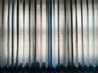 Full frame shot of light blue curtain.  Copy space on blue curtain.