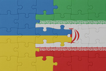 puzzle with the national flag of ukraine and iran . macro.concept.
