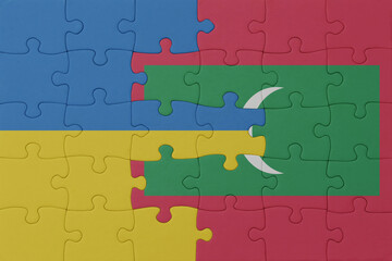 Fototapeta premium puzzle with the national flag of ukraine and maldives . macro.concept.