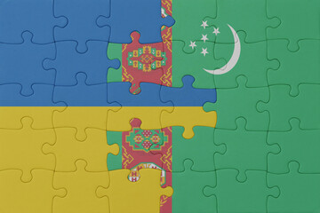 puzzle with the national flag of ukraine and turkmenistan . macro.concept.