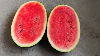 Picture of red slices of watermelon fruit cut shot during daylight in summers. Watermelon is rich...
