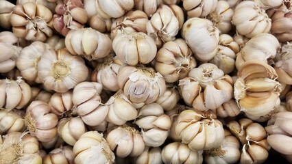A collection of garlic on display in the supermarket