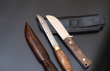 Damascus steel knives on a black background. Kitchen knives. background with japanese knife. A set...